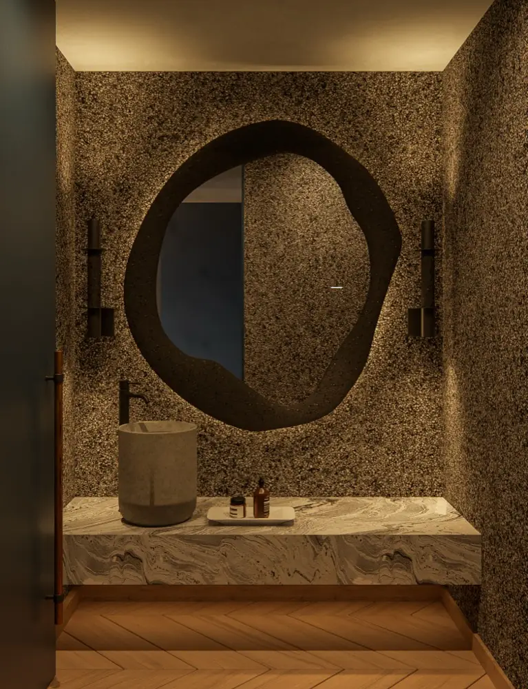Bathroom with stone wall and organic mirror
