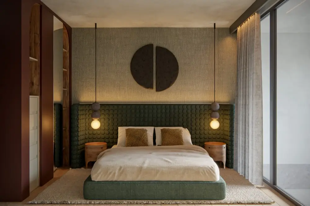 Master bedroom with green headboard and pendant lights